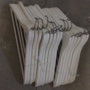 White wooden clothing hangers for home
